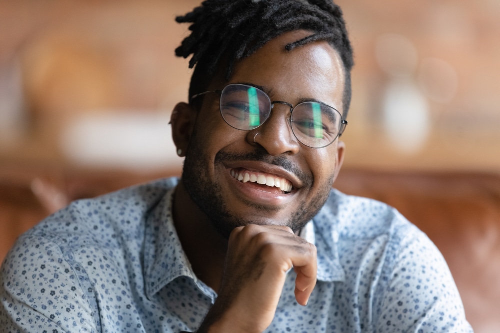 Cropped,Portrait,Of,Happy,Young,African,Male,In,Glasses,With